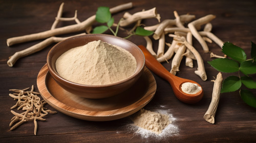 Ashwagandha powder in a wooden bowel with wood spoon.